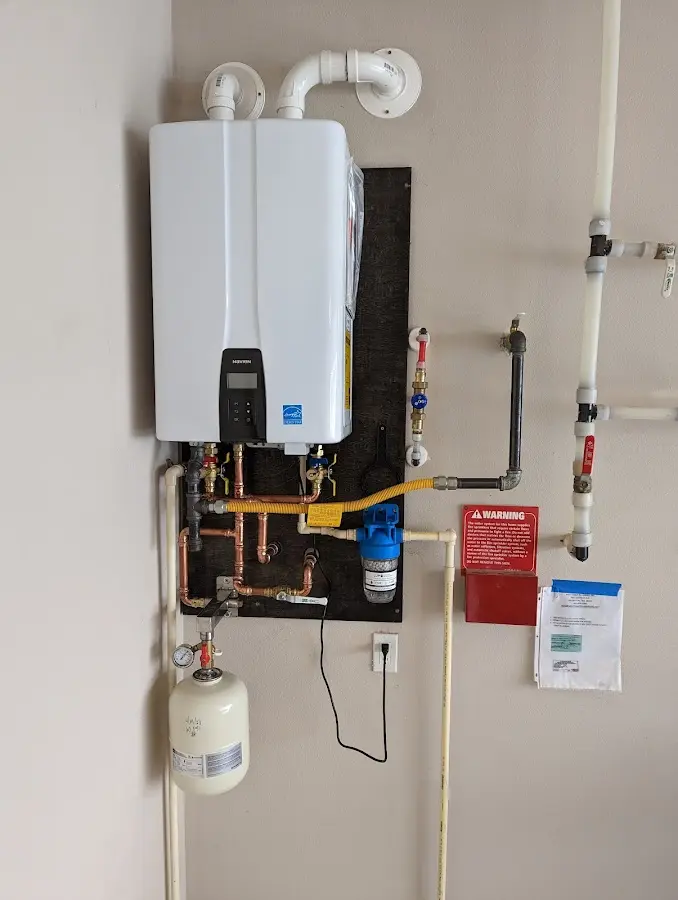 Professional plumber installing copper piping in a Indian Wells home